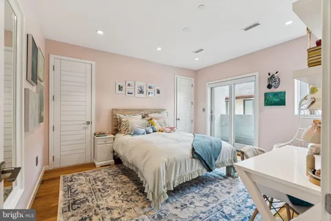 a bedroom with a bed and a table in it