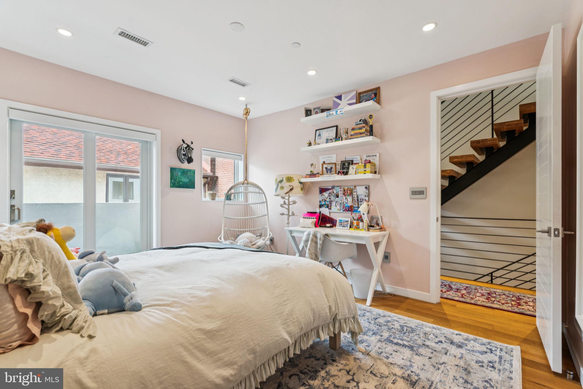 206 North 22nd Street, Unit E Philadelphia, PA 19103 - Photo 26 of 50 a bedroom with a bed and a window