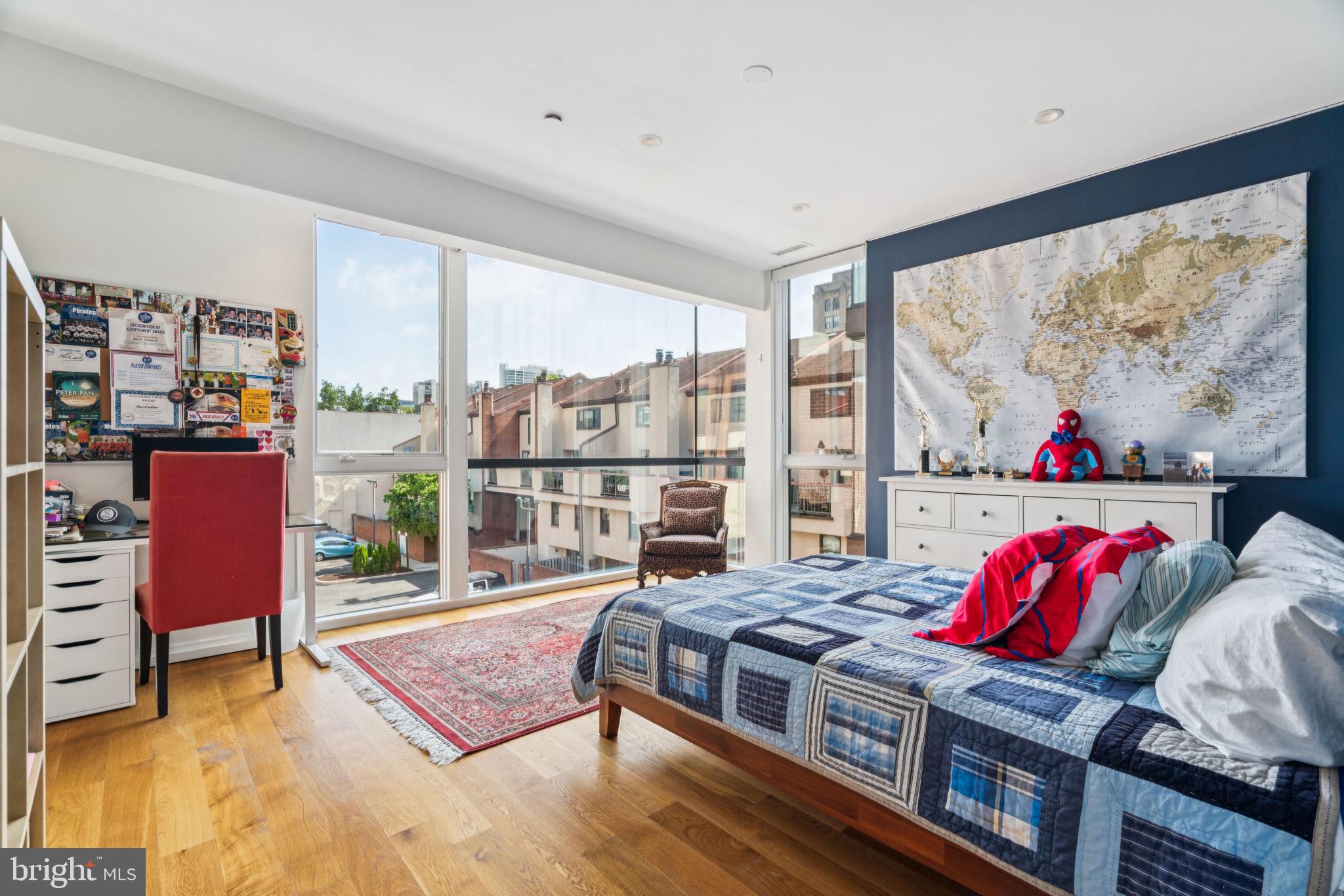 206 North 22nd Street, Unit E Philadelphia, PA 19103 - Photo 27 of 50 a living room with furniture rug and a large window