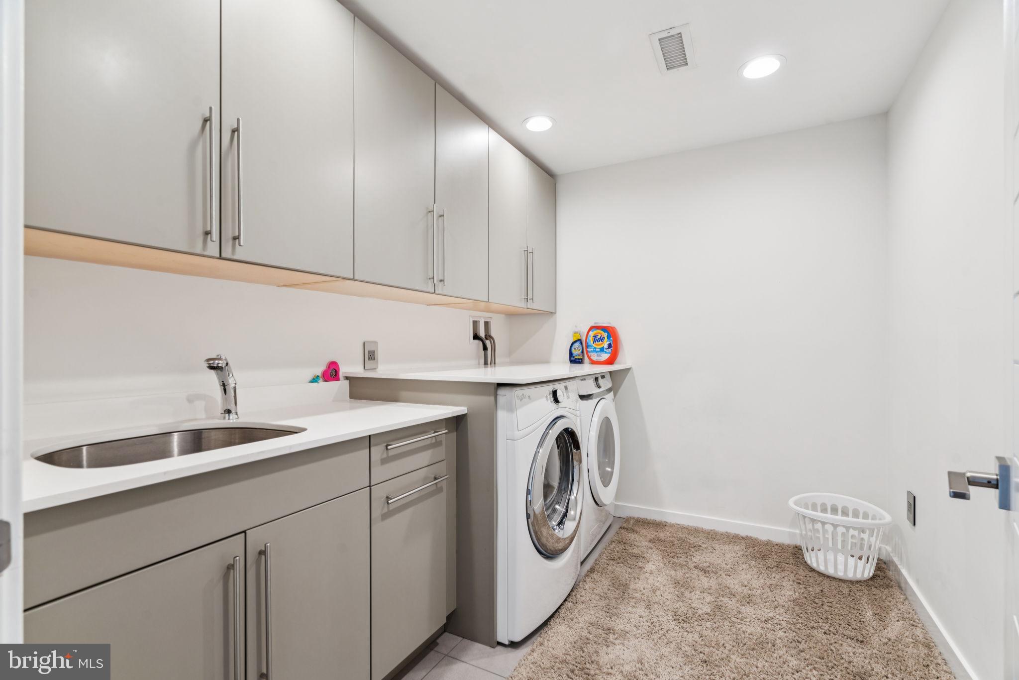 206 North 22nd Street, Unit E Philadelphia, PA 19103 - Photo 30 of 50 a utility room with sink dryer and washer
