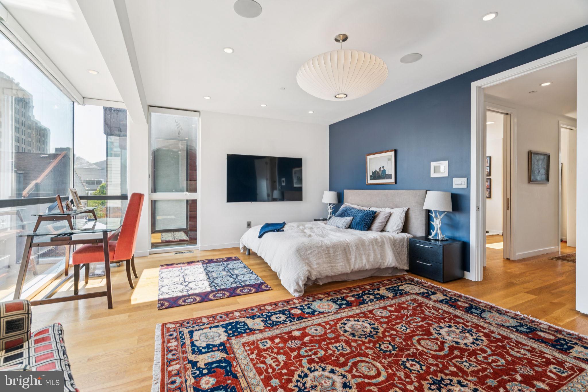 206 North 22nd Street, Unit E Philadelphia, PA 19103 - Photo 33 of 50 a living room with furniture and a flat screen tv
