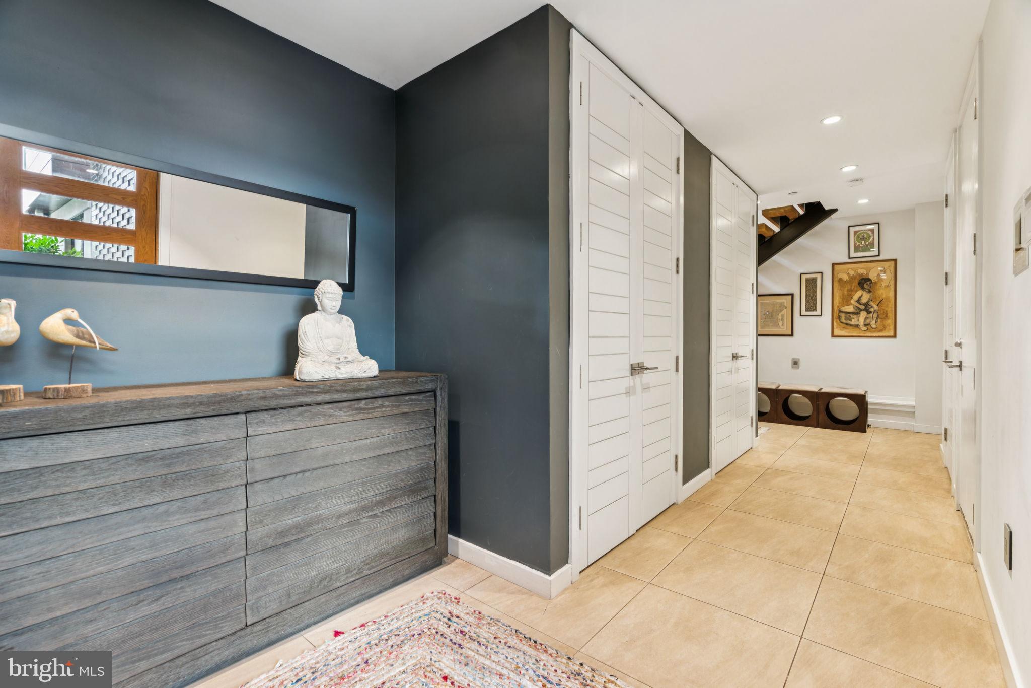 206 North 22nd Street, Unit E Philadelphia, PA 19103 - Photo 4 of 50 a view of a bedroom with wooden floor and cabinet