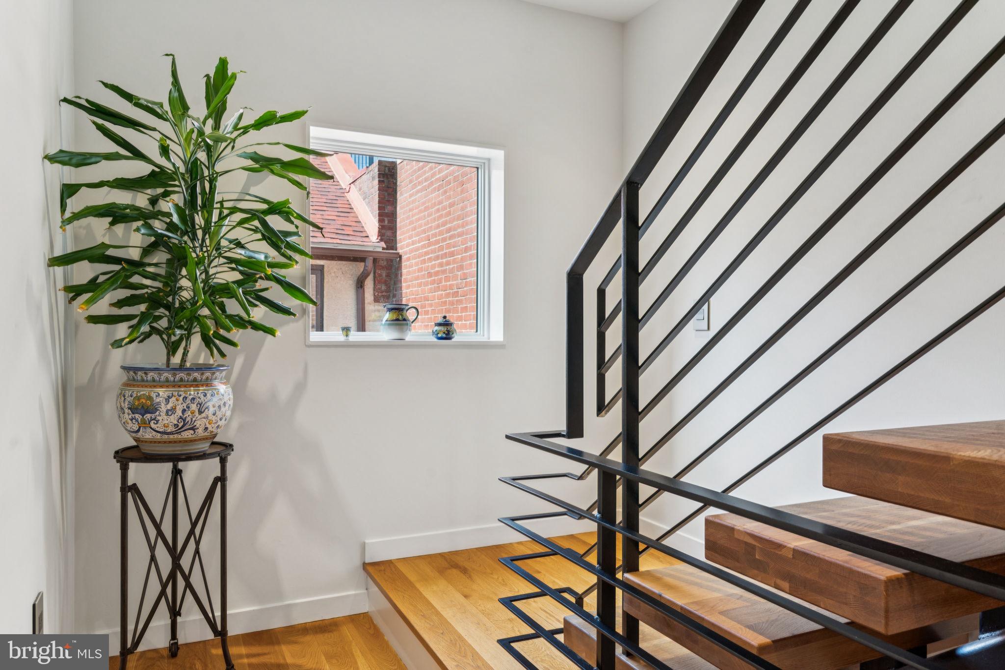 206 North 22nd Street, Unit E Philadelphia, PA 19103 - Photo 43 of 50 a vase of flowers sitting on a floor