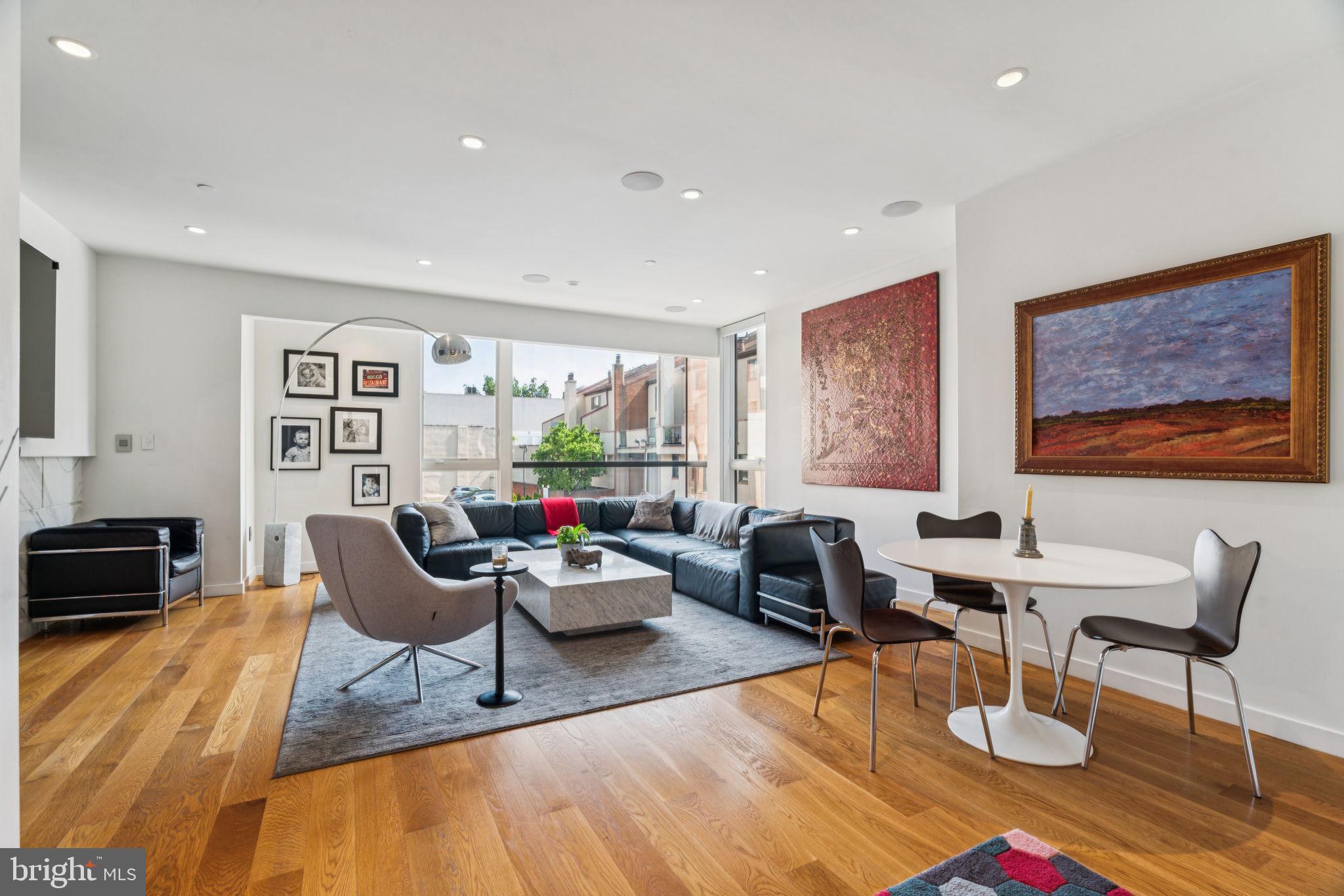 206 North 22nd Street, Unit E Philadelphia, PA 19103 - Photo 8 of 50 a living room with furniture and a rug