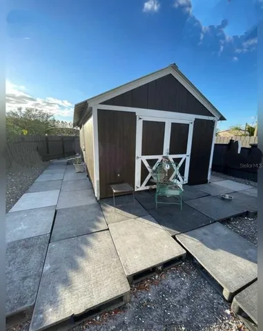 a front view of a house with table