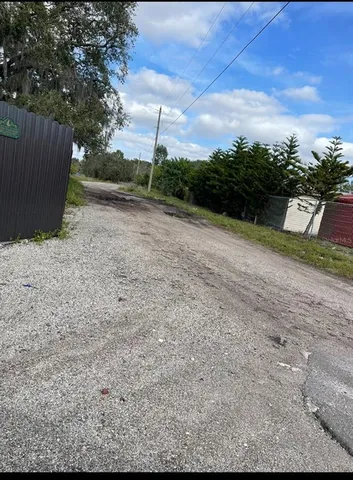 a view of backyard with green space