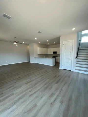 a white toilet sitting next to a bathroom sink