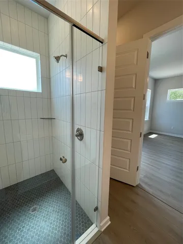 a bathroom with a double vanity sink and mirror