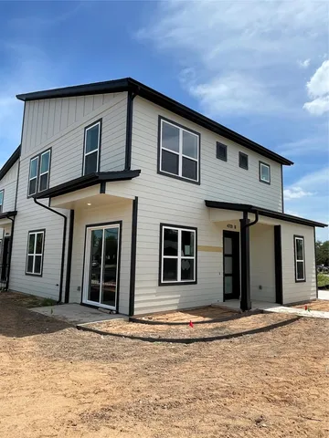 a front view of a house with garage