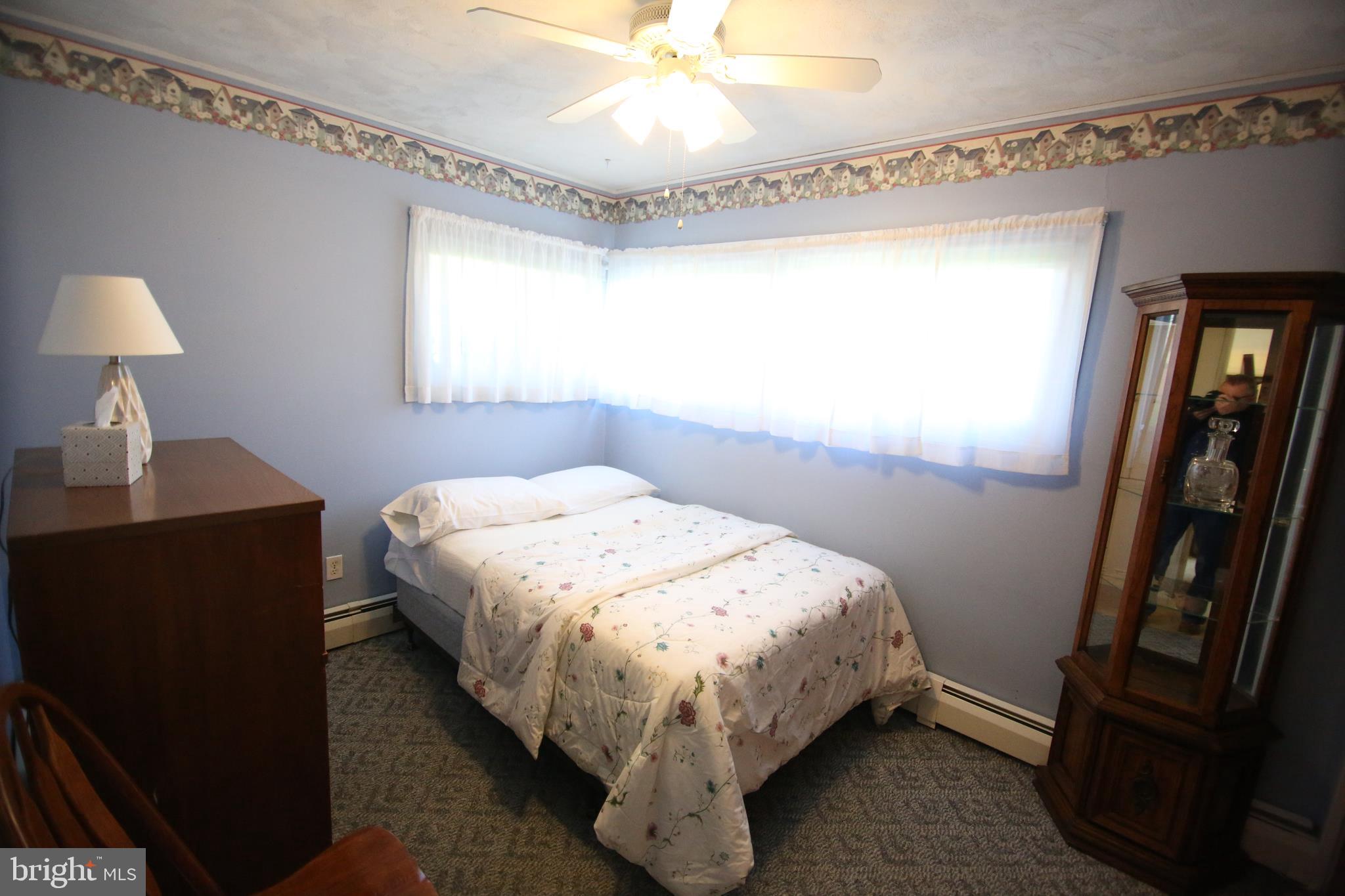 47 Trellis Road Levittown, PA 19056 - Photo 15 of 34 a bed sitting in a bedroom next to a window