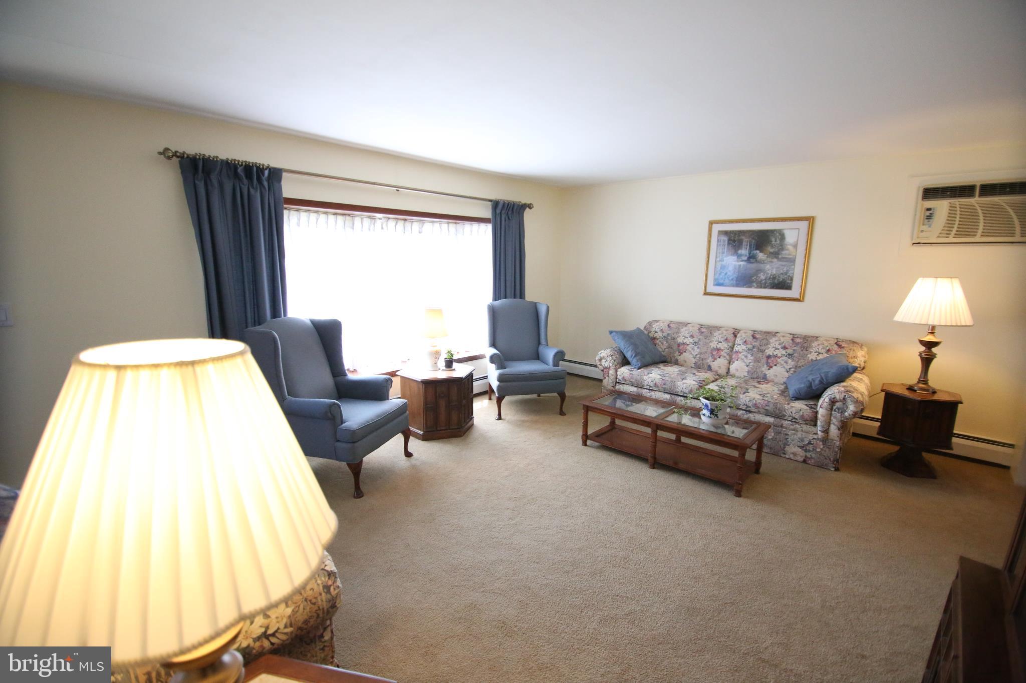 47 Trellis Road Levittown, PA 19056 - Photo 21 of 34 a living room with furniture and a large window