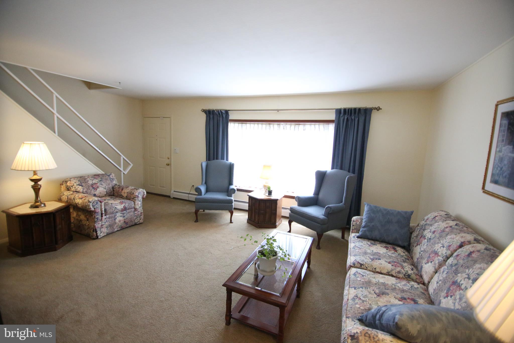 47 Trellis Road Levittown, PA 19056 - Photo 22 of 34 a living room with furniture and a large window