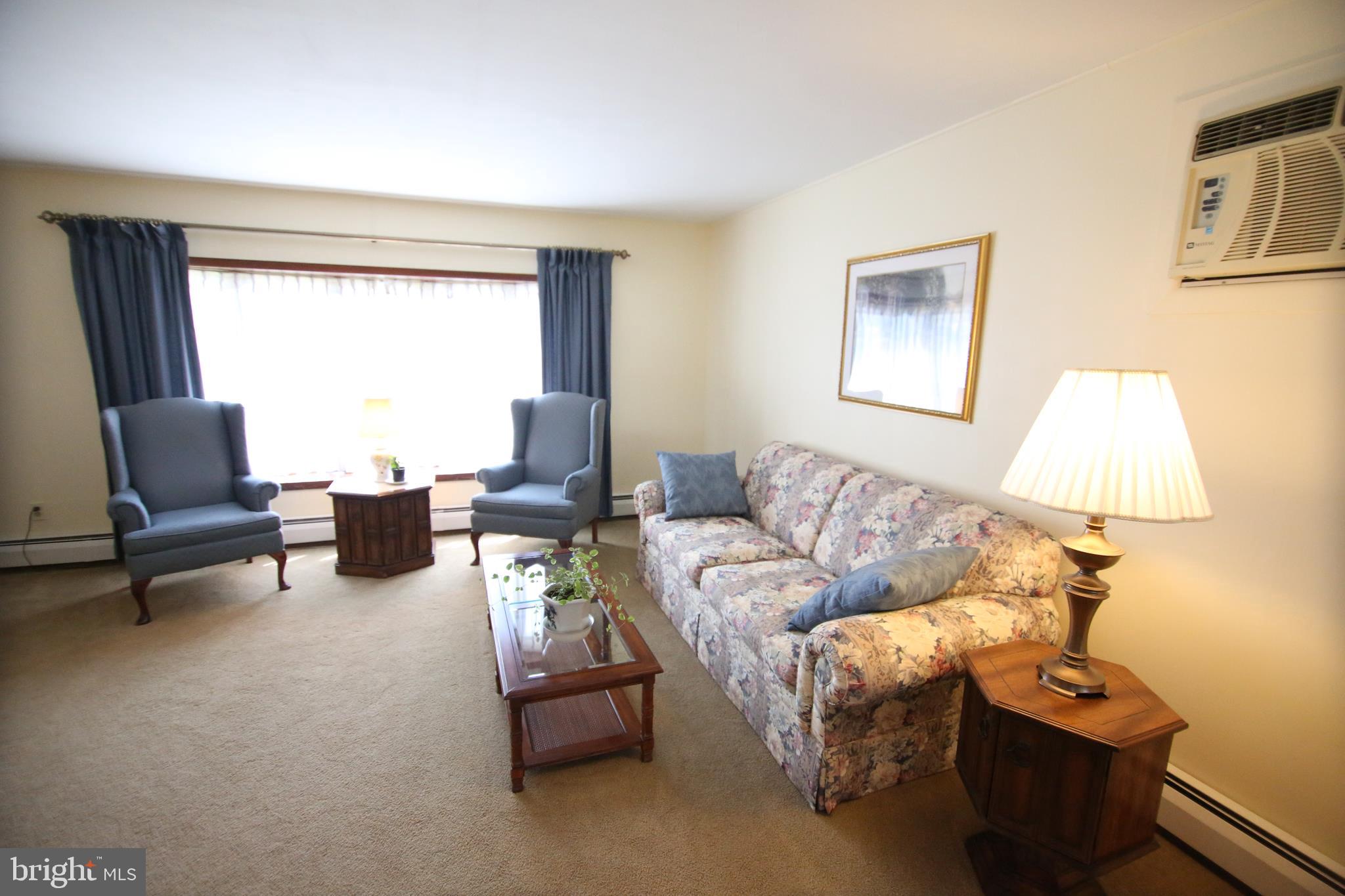 47 Trellis Road Levittown, PA 19056 - Photo 23 of 34 a living room with furniture and a window