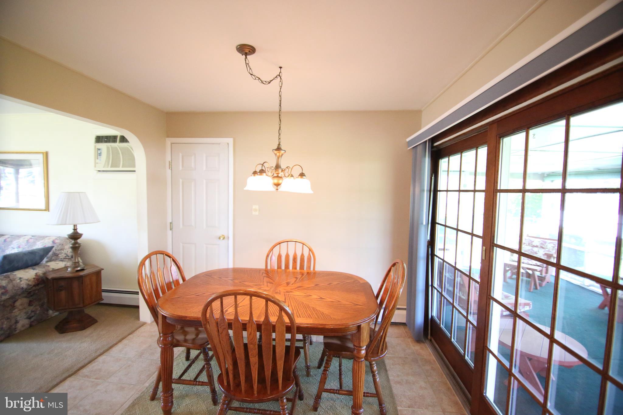 47 Trellis Road Levittown, PA 19056 - Photo 8 of 34 a view of a dining room with furniture window and outside view