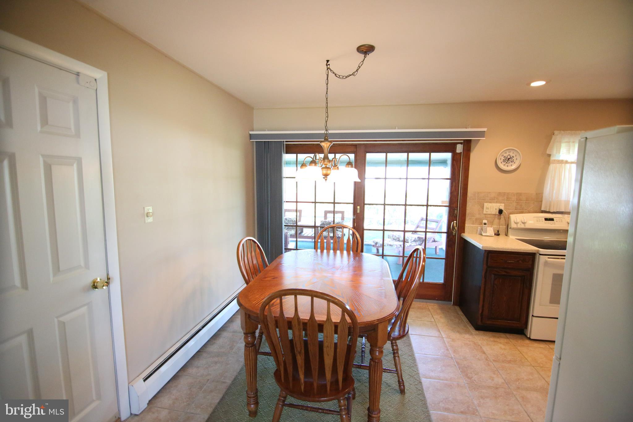 47 Trellis Road Levittown, PA 19056 - Photo 9 of 34 a view of a dining room with furniture window and outside view