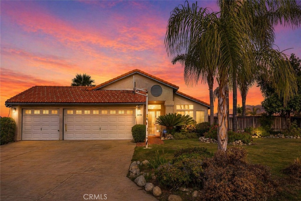 44194 Meadow Grove Street Hemet, CA 92544 - Photo 1 of 42 a front view of a house with a yard