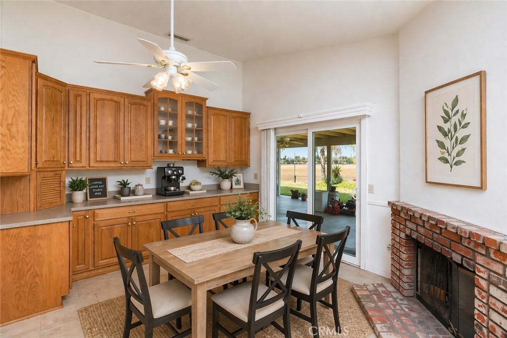 44194 Meadow Grove Street Hemet, CA 92544 - Photo 15 of 42 a view of a dining room with furniture window and wooden floor