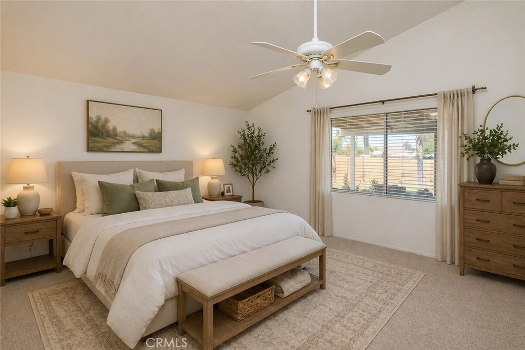 44194 Meadow Grove Street Hemet, CA 92544 - Photo 17 of 42 a bedroom with a bed and a chandelier