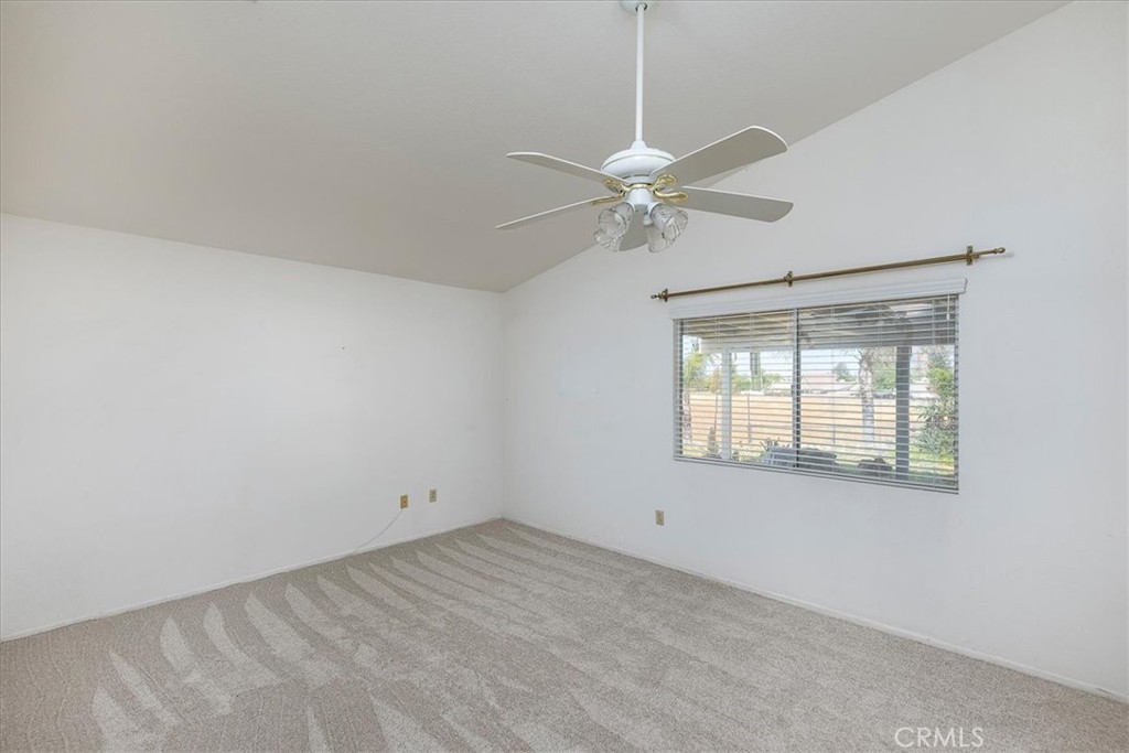 44194 Meadow Grove Street Hemet, CA 92544 - Photo 18 of 42 an empty room with a window and a fan