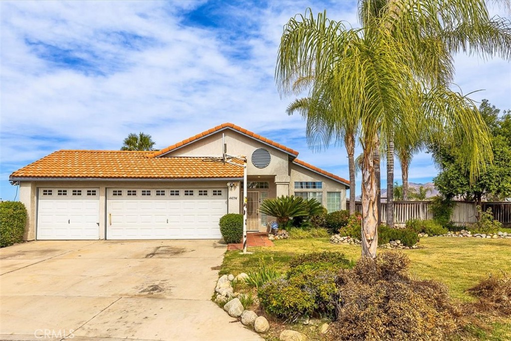 44194 Meadow Grove Street Hemet, CA 92544 - Photo 2 of 42 a front view of a house with a yard