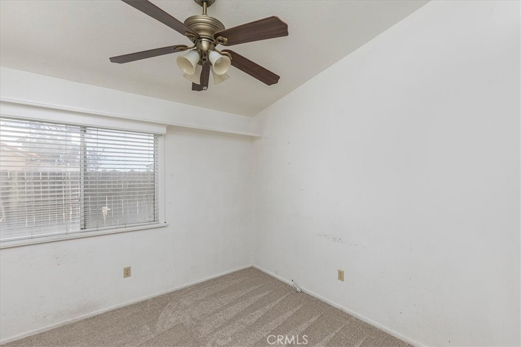 44194 Meadow Grove Street Hemet, CA 92544 - Photo 22 of 42 an empty room with a window and a fan