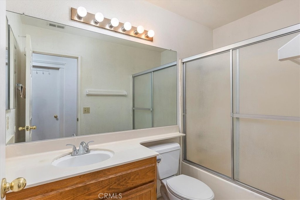 44194 Meadow Grove Street Hemet, CA 92544 - Photo 23 of 42 a bathroom with a sink toilet and shower
