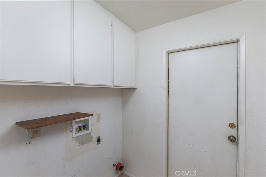 44194 Meadow Grove Street Hemet, CA 92544 - Photo 26 of 42 a view of cabinets with racks on the wall