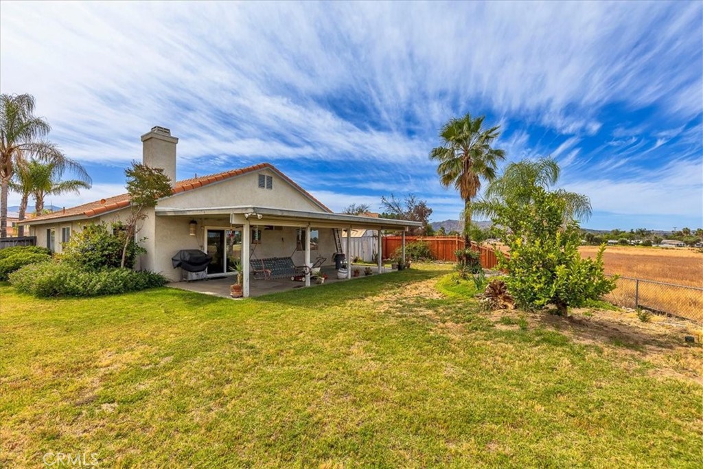 44194 Meadow Grove Street Hemet, CA 92544 - Photo 29 of 42 a front view of a house with a yard