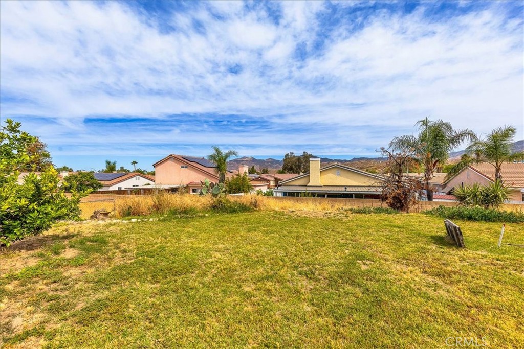 44194 Meadow Grove Street Hemet, CA 92544 - Photo 34 of 42 a view of a lake with a houses