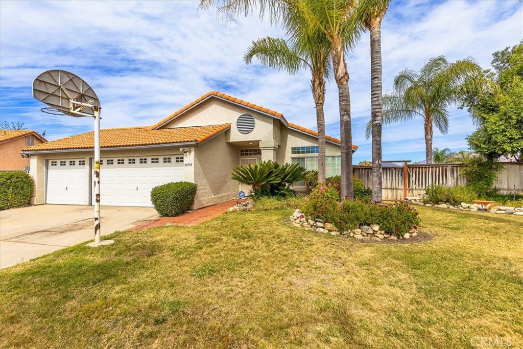 44194 Meadow Grove Street Hemet, CA 92544 - Photo 4 of 42 a view of a house with a swimming pool