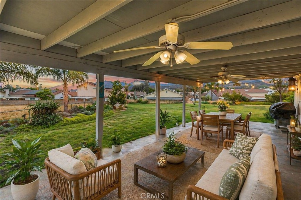 44194 Meadow Grove Street Hemet, CA 92544 - Photo 41 of 42 a view of a patio with couches potted plants and a big room