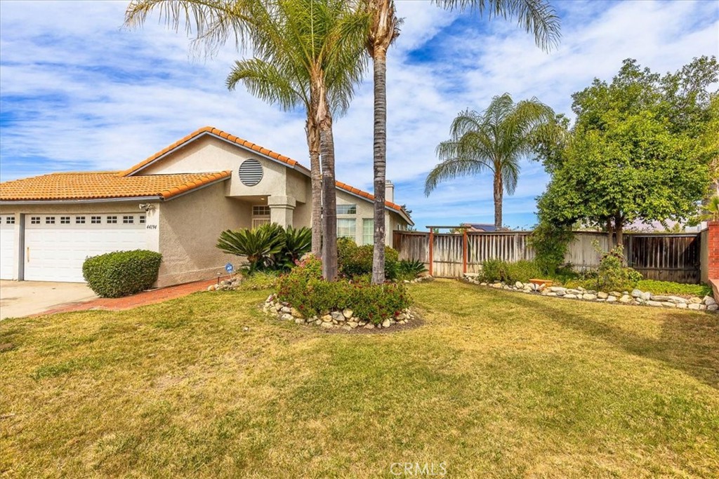 44194 Meadow Grove Street Hemet, CA 92544 - Photo 5 of 42 a view of a house with a swimming pool