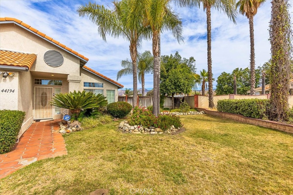44194 Meadow Grove Street Hemet, CA 92544 - Photo 6 of 42 a view of a house with a swimming pool