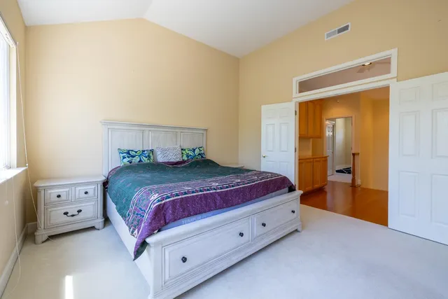 a bedroom with a bed and a cabinets