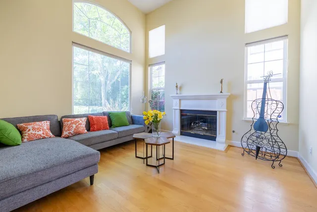 a living room with furniture and a fireplace
