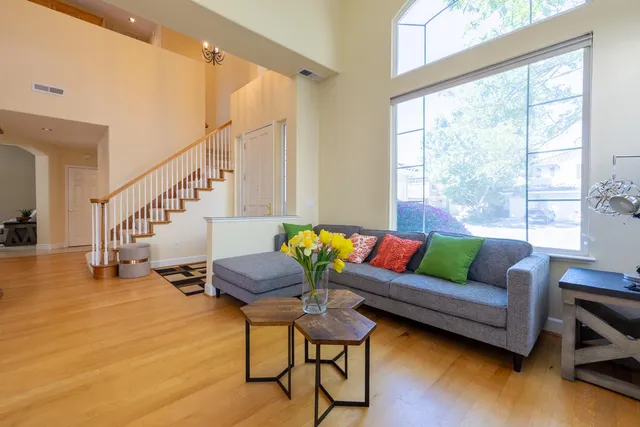 a living room with furniture and a large window