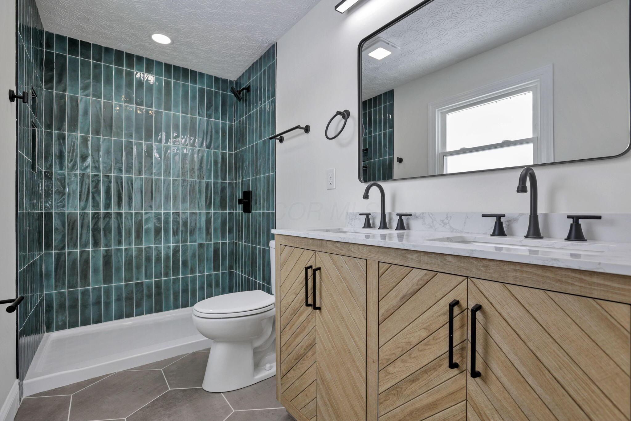 5273 Hayes Road Groveport, OH 43125 - Photo 10 of 89 Primary bathroom with all new tile work and two sinks!