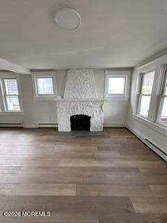 1721 River Road Belmar, NJ 07719 - Photo 4 of 14 an empty room with wooden floor and windows
