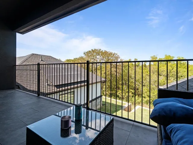 a view of balcony with furniture