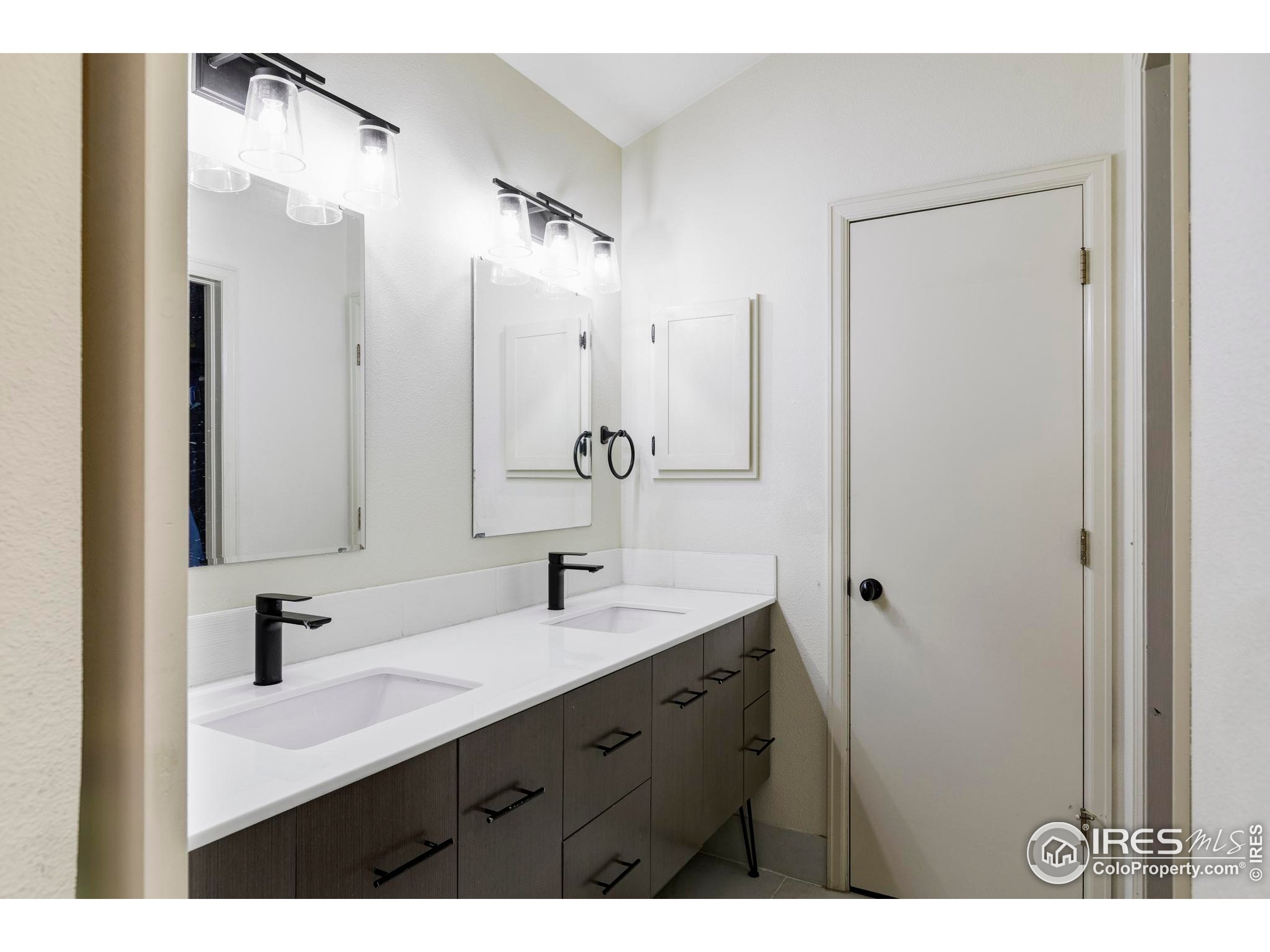 2770 Arbor Glen Place Boulder, CO 80304 - Photo 17 of 25 a bathroom with a sink and a mirror