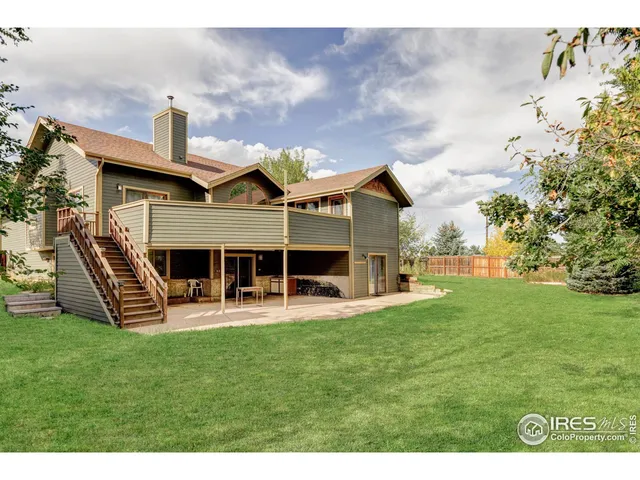 a view of a house with a yard porch and sitting area