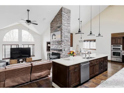 a kitchen with a sink a stove and a microwave