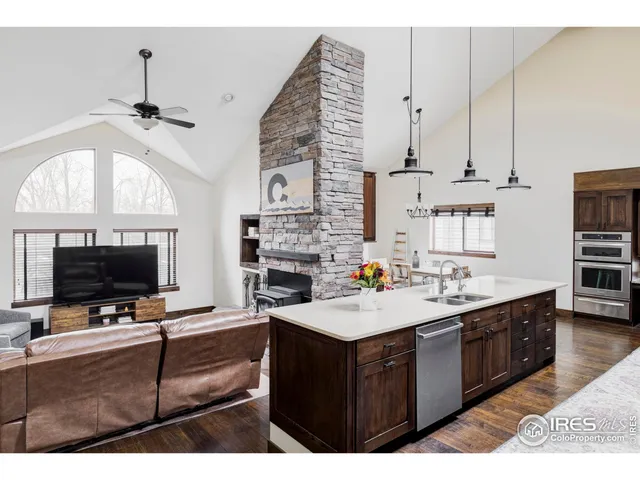 a kitchen with a sink a stove and a microwave