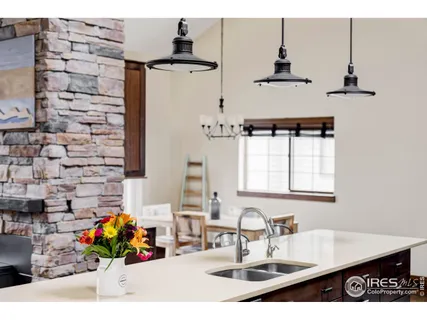 a bathroom with a sink a vanity and a shower