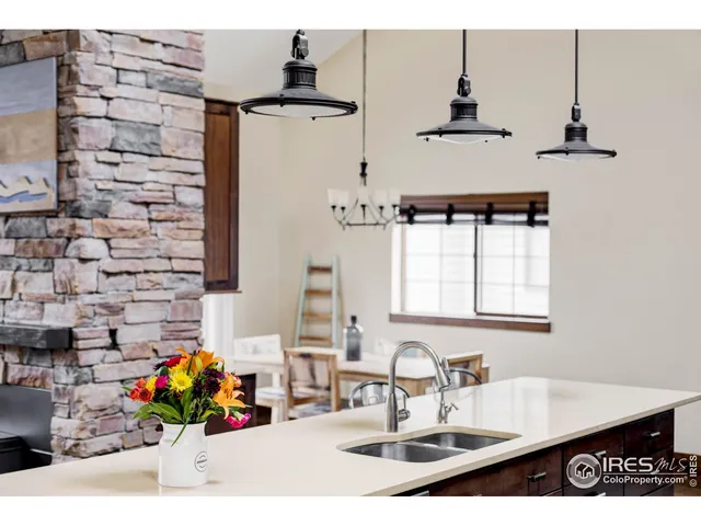 a bathroom with a sink a vanity and a shower