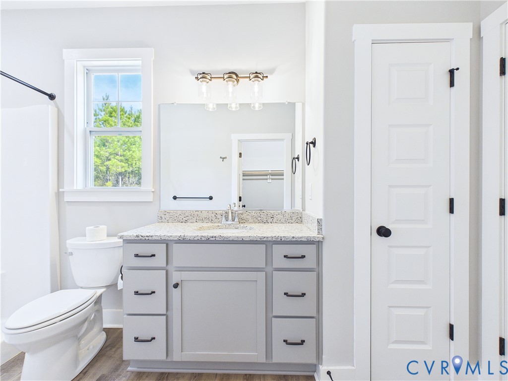 6795 Darlington Heights Road Cullen, VA 23934 - Photo 17 of 42 Bathroom featuring vanity, light wood-style floors