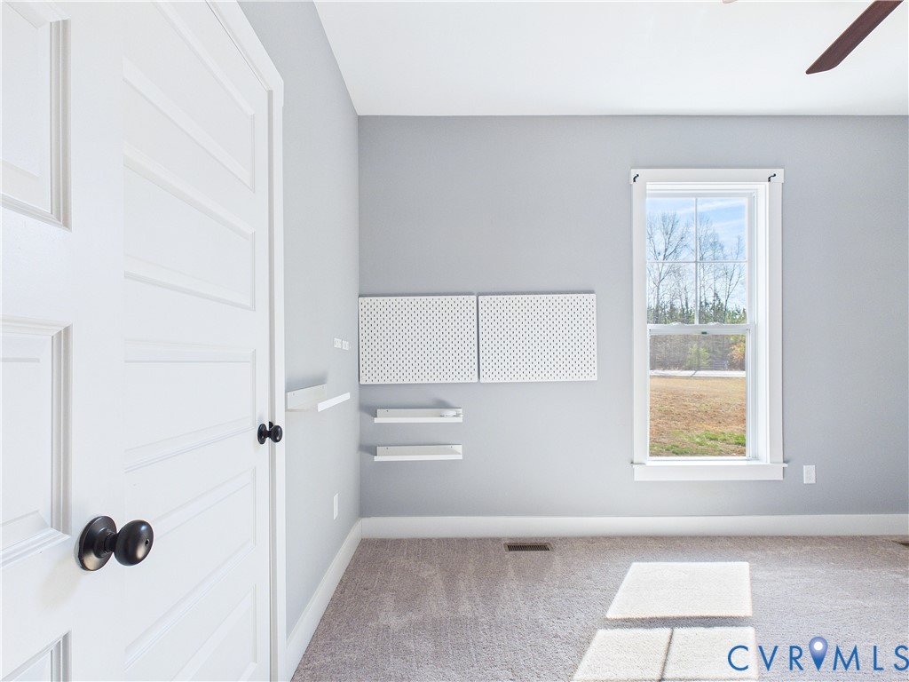 6795 Darlington Heights Road Cullen, VA 23934 - Photo 21 of 42 Spare room with a ceiling fan and light carpet