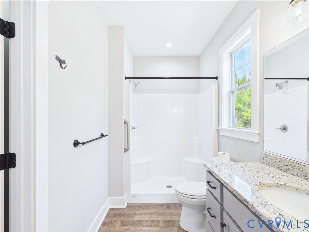 6795 Darlington Heights Road Cullen, VA 23934 - Photo 21 of 44 a bathroom with a granite countertop sink toilet and shower