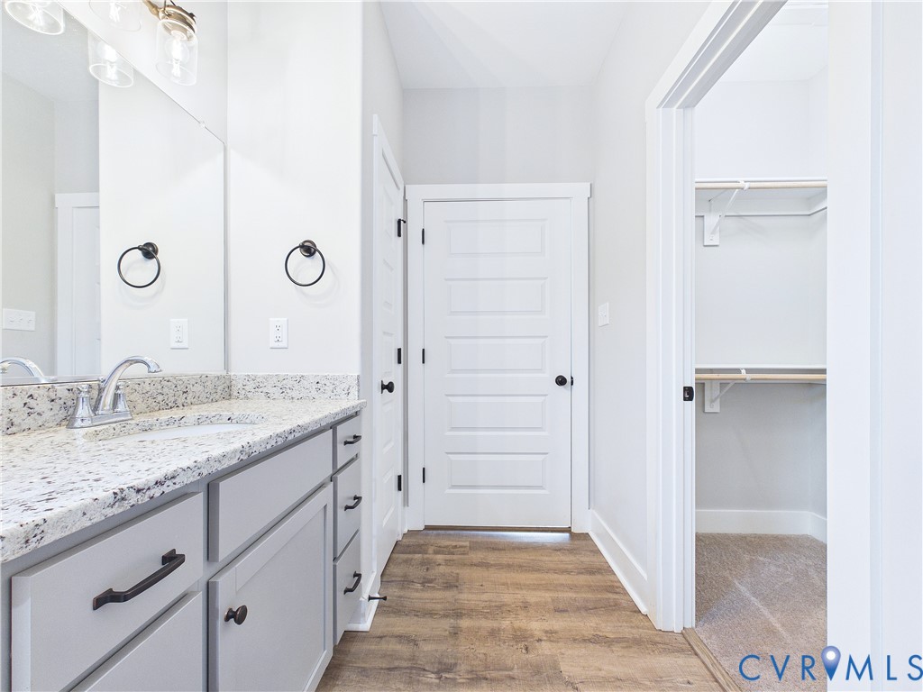 6795 Darlington Heights Road Cullen, VA 23934 - Photo 22 of 44 a bathroom with a granite countertop sink and a mirror