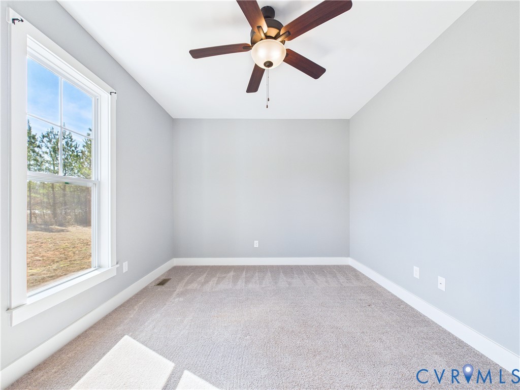 6795 Darlington Heights Road Cullen, VA 23934 - Photo 23 of 42 Spare room with light carpet and a ceiling fan